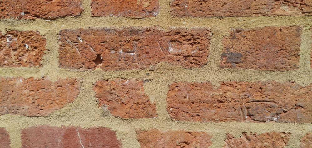 Bricks on Great Linford High Street with makers marks.
